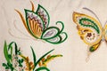 Colorful embroidery design in the form of butterflies and flowers.