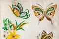 Colorful embroidery design in the form of flowers and butterflies.