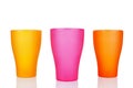 Colorful empty plastic cups white background isolated closeup, three disposable blank drinking glasses, beverage, cocktail Royalty Free Stock Photo