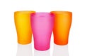 Colorful empty plastic cups white background isolated closeup, three disposable blank drinking glasses, beverage, cocktail Royalty Free Stock Photo