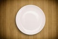 Colorful empty plate on grungy background table Royalty Free Stock Photo