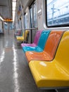 Colorful empty seats inside a modern subway train. Royalty Free Stock Photo