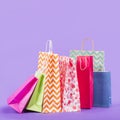 colorful empty shopping bags purple background. High quality beautiful photo concept Royalty Free Stock Photo