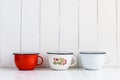 Colorful enameled mugs Royalty Free Stock Photo