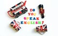 Colorful english words DO YOU SPEAK ENGLISH with souvenirs from London,English language learning concept Royalty Free Stock Photo