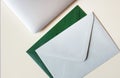 Colorful envelopes and laptop on table