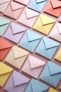 Colorful envelopes on a pink background