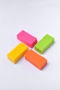 Colorful eraser. Pink, green, yellow and orange