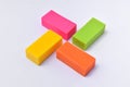 Colorful eraser. Pink, green, yellow and orange