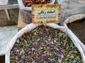 Colorful esfand sold in a traditional Iranian market