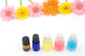 Colorful essential oil and flowers Royalty Free Stock Photo