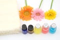 Colorful essential oil and yellow towel Royalty Free Stock Photo