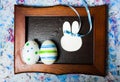 Colorful Ester eggs in a photo frame Royalty Free Stock Photo