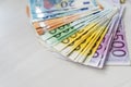 Colorful euro banknotes in fan on wooden table Royalty Free Stock Photo