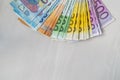 Colorful euro banknotes in fan on wooden table Royalty Free Stock Photo