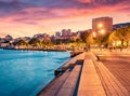 Colorful evening cityscape of Saranda port. Great sunrise on Ionian sea. Royalty Free Stock Photo