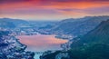 Colorful evening landscape of the city Lecco and Lake Garlate Royalty Free Stock Photo