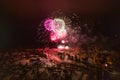 Colorful Explosions of Festive Fireworks Illuminate the Night Sky Valmiera. Colorful exploding fireworks light up the night sky