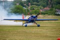 Colorful Extra EA-300 airplane model at Hangariada aeronautical festival show