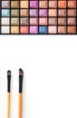 Colorful eye shadows palette with makeup brush. Royalty Free Stock Photo