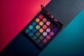 Colorful eyeshadow palette on vibrant background