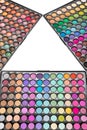 Colorful eyeshadow palettes isolated on a white background. Make-up eyeshadow palettes arranged in form of triangle