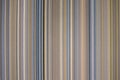 colorful fabric background with soft faded rainbow-colored vertical stripes