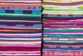 Colorful fabric and bath towels stacked in rows, pattern background