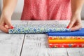 Colorful fabric in female hands, closeup Royalty Free Stock Photo