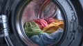Colorful fabric inside washing machine drum with soft texture ready for laundry cycle in modern appliance Royalty Free Stock Photo