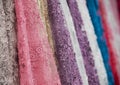 Colorful fabric lace fabric rolls in textile shop industry.Rolls of bright colored fabric Royalty Free Stock Photo