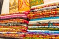 Colorful fabrics on display at Dubai Old Souk shop UAE Royalty Free Stock Photo