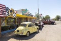 Colorful facade of Historic Seligman souvenir shop with vintage cars in front
