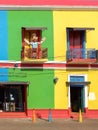 Colorful facade in La Boca district, Buenos Aires, Argentina. Statue of Messi in a balcony. Royalty Free Stock Photo