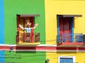 Colorful facade in La Boca district, Buenos Aires, Argentina. Statue of Messi in a balcony. Royalty Free Stock Photo