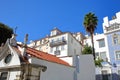 Colorful facades in Alfama neighborhood with a Russian Orthodox Church Ortodoxa Russa in the foreground, Lisbon, Portugal