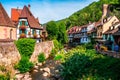 Colorful facades and flowers overlooking the river in the village of Kaisersberg in Alsace, France Royalty Free Stock Photo