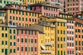 Colorful facades of historic buildings in the city of Camogli in Italy. Sea front houses with windows and balconies