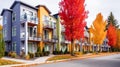 Colorful facades of houses in a row with autumn leaves. Royalty Free Stock Photo