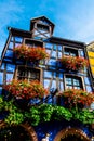 The colorful facades of the houses of the village of Riquewhir, in Alsace, France