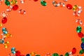 colorful fake gemstone on orange background in the middle of the background copy space, creative modern art design Royalty Free Stock Photo