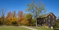 Colorful Fall Foliage and an Old Mill Building Royalty Free Stock Photo