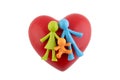 Colorful family figurines with red heart on white background