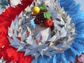 Colorful fantasy headdress background with feathers, fruits and silver glittering garlands. Fantasy headdresses pattern