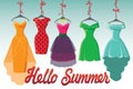 Colorful fashion colored dresses hang on ribbon.Hello summer!