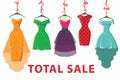 Colorful fashion colored dresses hang on ribbon.Total Sale