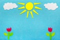 Colorful felt background with sun, clouds and tulip flowers,