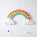 Colorful Felt Rainbow and Cloud Mobile with Stars on White Background Royalty Free Stock Photo