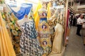 Colorful female fashion showcase with patterned textile in dress store