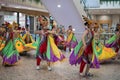 Colorful Female Performers Dance in the Mall